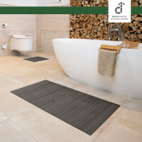 Drei rechteckige Badezimmerteppiche in verschiedenen Größen, jeweils mit vertikalen Linienmuster und einem dekorativen Element, das an eine Blume erinnert. Die Teppiche haben eine Breite von 17 mm und Längen von 40 cm, 50 cm und 60 cm sowie 50 cm, 80 cm und 100 cm. Ideal für die Verwendung im Badezimmer.