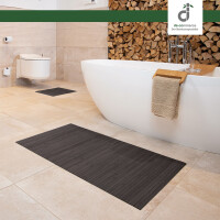 Drei rechteckige Badezimmerteppiche in verschiedenen Größen, jeweils mit vertikalen Linienmuster und einem dekorativen Element, das an eine Blume erinnert. Die Teppiche haben eine Breite von 17 mm und Längen von 40 cm, 50 cm und 60 cm sowie 50 cm, 80 cm und 100 cm. Ideal für die Verwendung im Badezimmer.