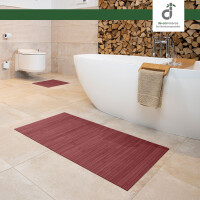 Drei rechteckige Badezimmerteppiche in verschiedenen Größen, jeweils mit vertikalen Linienmuster und einem dekorativen Element, das an eine Blume erinnert. Die Teppiche haben eine Breite von 17 mm und Längen von 40 cm, 50 cm und 60 cm sowie 50 cm, 80 cm und 100 cm. Ideal für die Verwendung im Badezimmer.